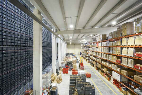 Warehouse aisle with pallet racking and cardboard boxes