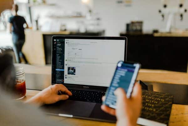 laptop open to an email inbox on a desk