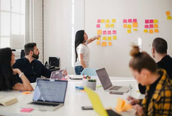 Team collaborating around a table in a workshop